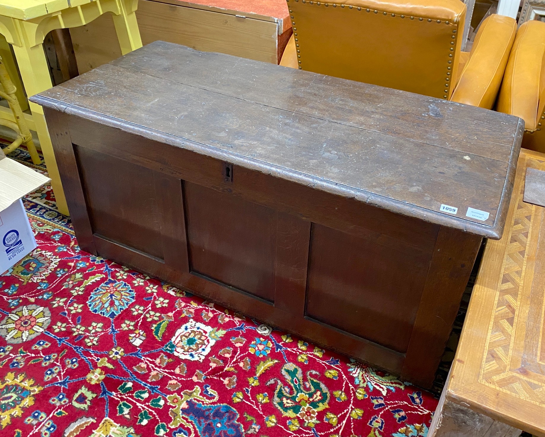 An 18th century panelled oak coffer, width 122cm, depth 54cm, height 53cm